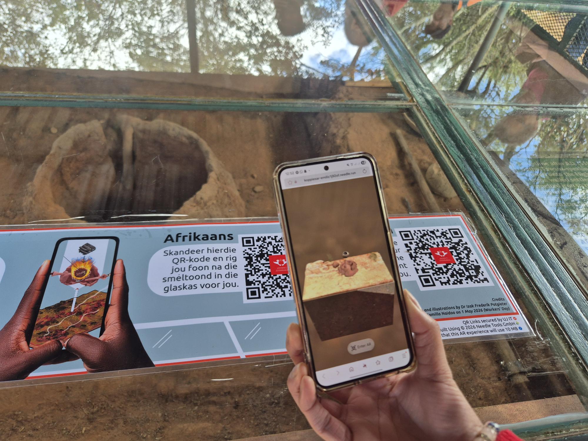 The AR project allows visitors to use their smartphones to see a historically grounded, 3D reconstruction of the ancient smelter digitally overlaid directly onto the existing remains using QR codes. 