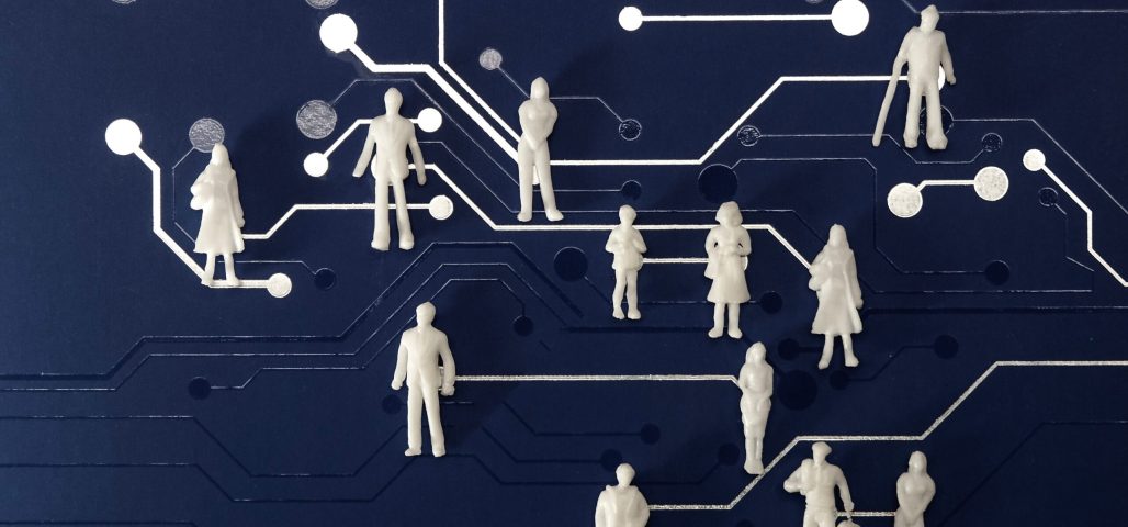 miniature-figures-on-a-blue-computer-chip-backgrou-2026-01-07-01-46-22-utc